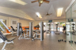 Modern fitness center at Park at Murano, featuring weight machines and cardio equipment.