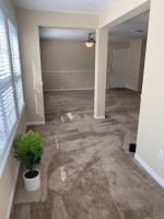 Bright and spacious living area of an apartment at The Park at Catania with stylish decor and natural light.