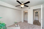Cozy 1-bedroom apartment interior featuring neutral walls and a ceiling fan in Fort Myers, FL.