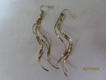 7 gold tone dangly earrings and 1 necklace
