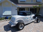 1932 Ford Roadster Hi Boy with custom flames parked on a driveway in California.