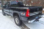 2006 Chevrolet Silverado 2500 HD, black, 4x4, rust-free truck parked in snow, showing rear and side details.