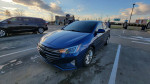 2019 Hyundai Elantra SEL parked in a lot, showcasing its sleek design and features.