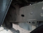 Undercarriage view of a 2005 Toyota Tacoma showcasing its frame and components.