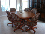 Oak Oval Pedestal  Dining room Table with 2 leaves.