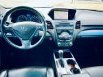 Interior view of 2014 Acura RDX with navigation, leather seats, and dashboard features