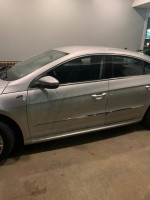 2010 Volkswagen CC in silver, featuring sleek design and good condition with minor rust, ideal for car enthusiasts.