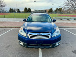 Front view of a 2011 Subaru Outback parked, showcasing its clean design and condition