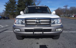 Front view of a 2006 Toyota Land Cruiser with 57,000 miles, parked in an open lot.