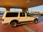 Clean, rust-free 2001 Ford Excursion SUV with 5.4L V8, freshly rebuilt transmission, parked outside.