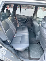 Interior view of 2001 Toyota RAV4 showing clean leather seats and spacious rear seating area