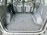 Clean interior of a 2001 Toyota RAV4 showing folded rear seats and spacious cargo area.