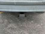 Tow hitch on a 2004 Chevrolet Astro cargo van, highlighting its towing capability.