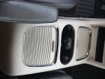 Interior cup holder and air vent details of a 2019 Dodge Grand Caravan SXT minivan