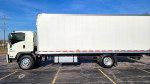 Side view of a 2021 Isuzu FTR box truck with liftgate and aluminum wheels.