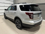 2013 Ford Explorer Sport AWD in silver with black accents, showcasing a panoramic roof and sporty design.