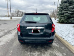 Rear view of a well-maintained 2013 Chevrolet Equinox LS parked in a snowy area, showcasing its clean design.