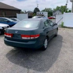 Honda Accord car parked with tinted windows and clean title in a parking lot.