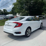 2017 Honda Civic Sport in white, parked with clean title and good mileage, perfect for financing.