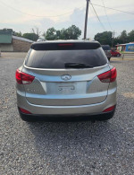 Rear view of a 2015 Hyundai Tucson GLS in perfect condition, driven 110,000 miles, for sale at $2300.
