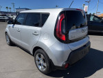2015 Kia Soul wagon in bright silver color with a rear view, showcasing 64,127 miles and alloy wheels.