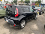 2015 Kia Soul in shadow black, showcasing its exterior design and features in a car lot setting.