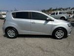 2019 Chevrolet Sonic LT in Silver Ice Metallic, showing side view with slight tint, 78,138 miles, front-wheel drive hatchback.