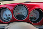 Dashboard of a red 2006 Chrysler PT Cruiser showing speedometer, fuel gauge, and odometer at 119058 miles.