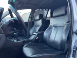 Interior view of a 2002 BMW 5 Series 525i with black leather seats and modern dashboard