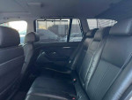 Interior view of a 2002 BMW 5 Series 525i wagon with black leather seats and rear space.