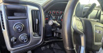 Interior view of 2018 GMC Sierra 1500 SLT with controls and dashboard indicators.