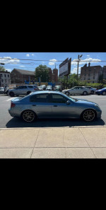 2003 INFINITI G35 sedan in blue, parked on street, ready for sale at $2500 with clean title and low mileage.