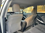 Interior view of a 2012 Toyota Prius Four with clean upholstery and spacious seating.
