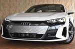 Front view of a 2022 Audi e-tron GT Premium Plus in Ibis White showcasing its sleek design and features.