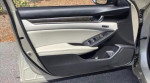 Interior view of the 2019 Honda Accord Sport showing the driver side door panel and controls.