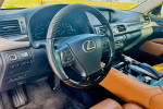 Interior view of a 2013 Lexus LS 460 L showcasing the steering wheel and dashboard controls.