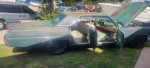 1964 Cadillac DeVille with 41k original miles, showing green exterior and open doors, for sale in good condition.