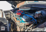Engine compartment of a 1991 Ford F-250 XL with well-maintained components.