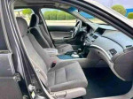 Interior view of a well-maintained 2008 Honda Accord EX with clean grey seats and modern dashboard features.