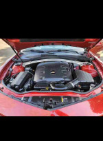 Engine view of a 2015 Chevrolet Camaro LS showcasing its powerful V6 performance and clean setup.