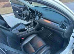 Interior of a 2017 Honda Civic EX with black leather seats and modern dashboard features.