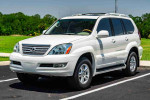 2007 Lexus GX 470 SUV in Blizzard Pearl with luxurious interior and V8 engine parked outdoors.