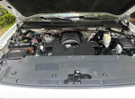 Under the hood of a 2014 GMC Sierra 1500 showing engine and components
