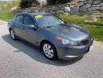 2008 Honda Accord EX-L in gray, showcasing its stylish design and premium features, parked on a scenic road.