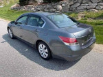 2008 Honda Accord EX-L in gray, parked on the side of a road, showcasing its sleek design and stylish rear view.