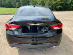 Rear view of a black 2016 Chrysler 200S parked outdoors with clean lines and shiny finish.