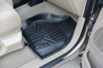 2005 Ford F-250 Super Duty XLT floor mat in beige interior showing durable protection for truck's flooring.