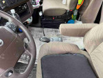 Interior view of a 1990 Volvo 760 GLE showing steering wheel and armrest, in good condition ready to drive.