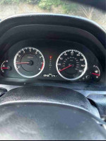 Dashboard of a 2012 Honda Accord EX-L V-6 with 90,000 miles, showing speedometer and controls.