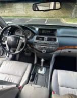 Interior view of a 2012 Honda Accord EX-L V-6 with leather seats and modern dashboard features.